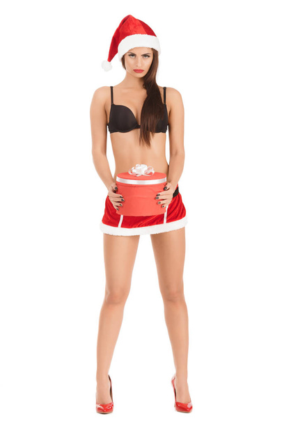 woman wearing santa claus clothes with Christmas gift - Foto, Imagen
