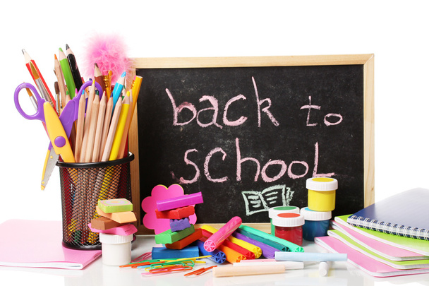 The words 'Back to School' written in chalk on the small school desk with v - Photo, Image