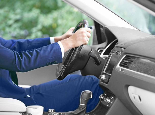 Young businessman driving car - Фото, изображение