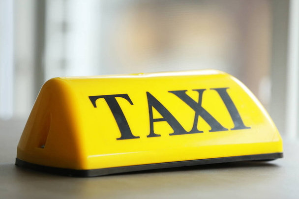 Yellow taxi roof sign - Foto, Imagen
