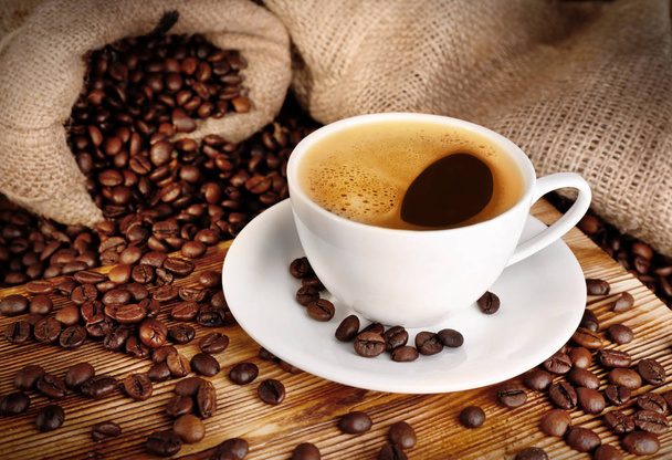 Cup of coffee with roasted beans - Photo, Image