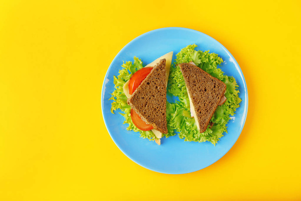 Blue plate with tasty sandwiches - Фото, зображення