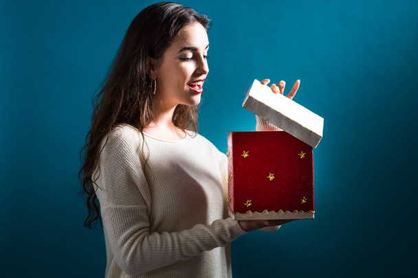 Happy young woman with Christmas present box - Zdjęcie, obraz