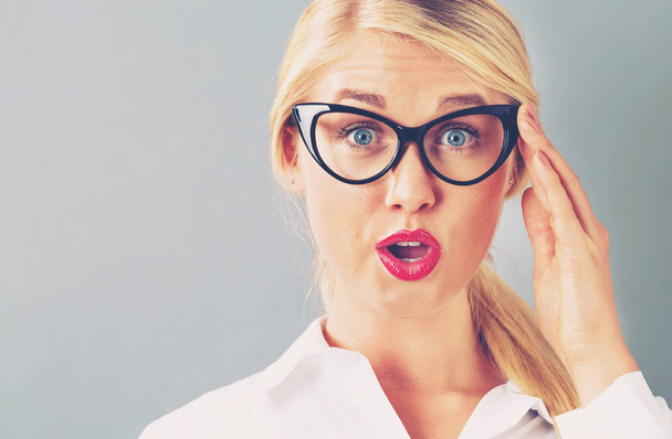 Young blonde businesswoman in black glasses - Photo, image
