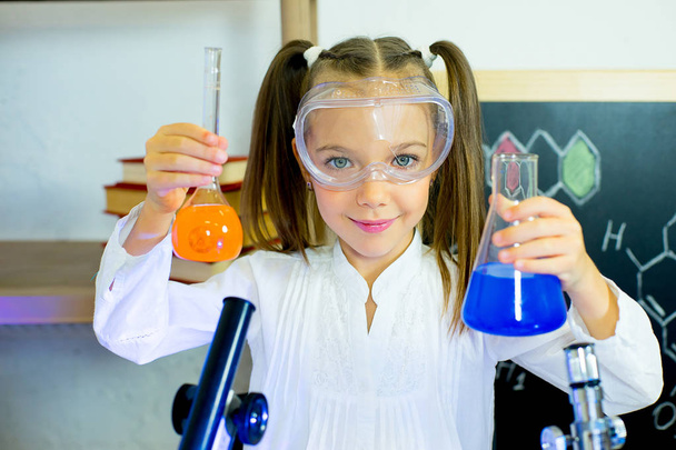 young girl making science experiments - Fotó, kép