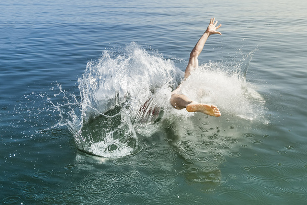 jumping into the water - Фото, зображення
