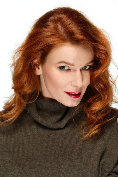 Pretty fashion model with red hair, lips and green eyes posing.  - Fotó, kép