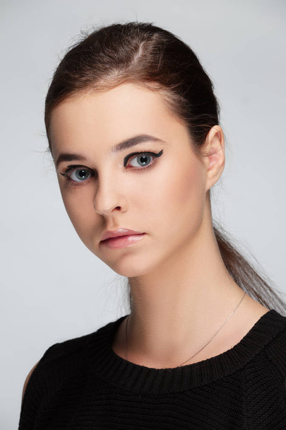 Face of beautiful young woman in beige peignoir. Beauty portrait, fresh skin. Natural makeup. - Fotó, kép
