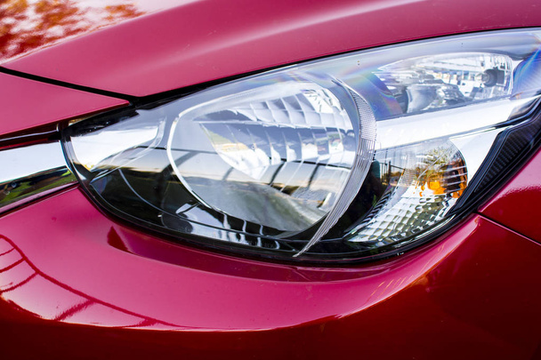 Closeup headlights of red car - Valokuva, kuva