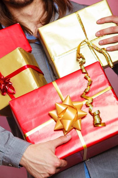 Male hands with many presents gift boxes - Photo, Image