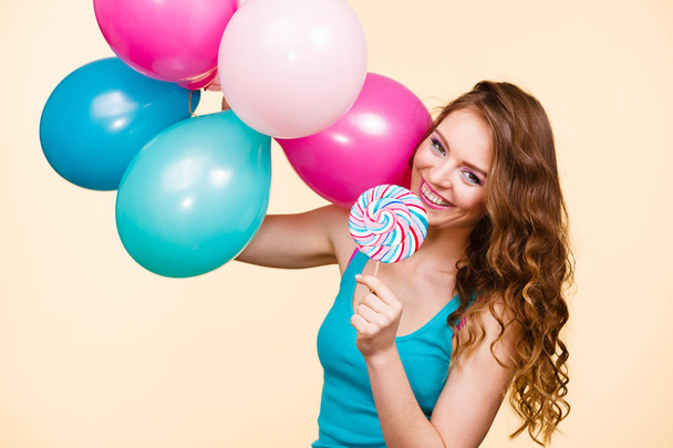 Woman with colorful balloons and lollipop - Foto, afbeelding