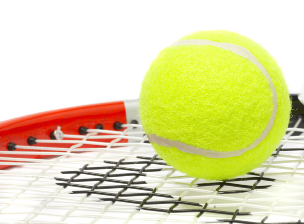 Tennis racket with a ball. - Фото, изображение
