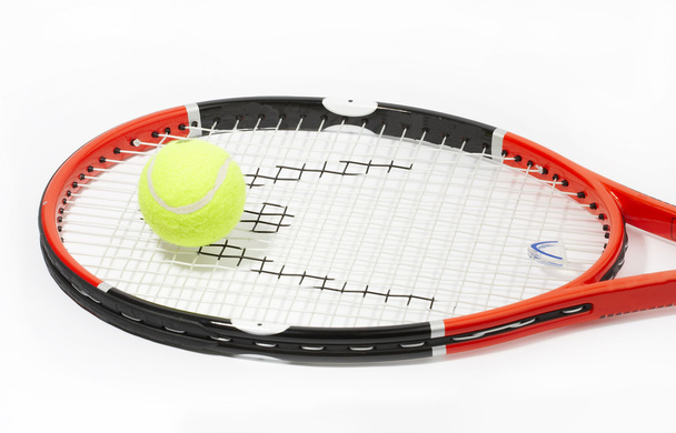 Tennis racket with a ball on a white bac - Foto, Imagem