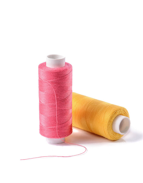 Colorful bobbin thread on white background - Photo, Image