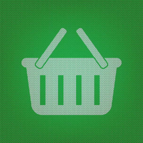 Shopping basket sign. white icon on the green knitwear or woolen - Vector, Image