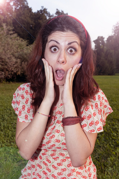 Surprised girl with big glasses at the park - 写真・画像