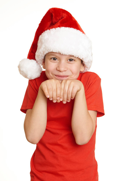 boy child portrait in santa hat, having fun and emotions, winter holiday concept - Foto, Imagem