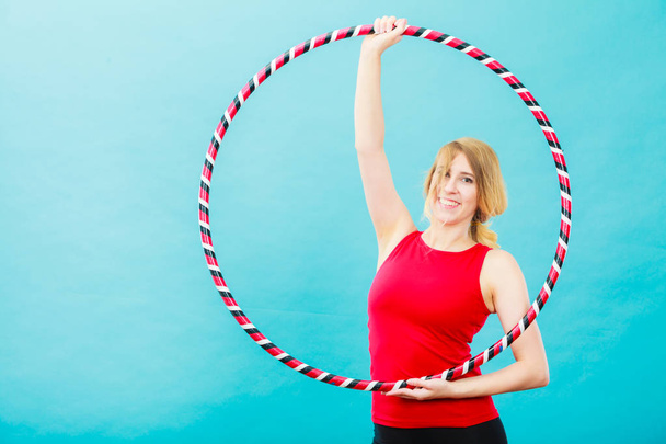 Fit woman with hula hoop doing exercise - Foto, immagini