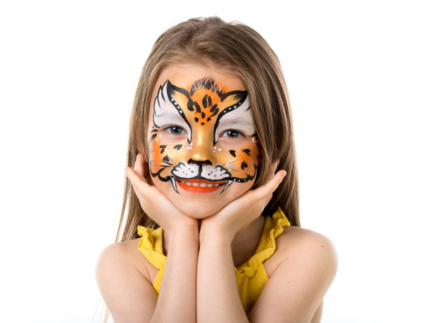 cute little girl with painted face - 写真・画像