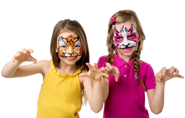two little girls with painted faces - Fotó, kép