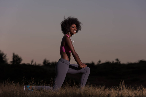 black woman is doing stretching exercise relaxing and warm up - Fotografie, Obrázek