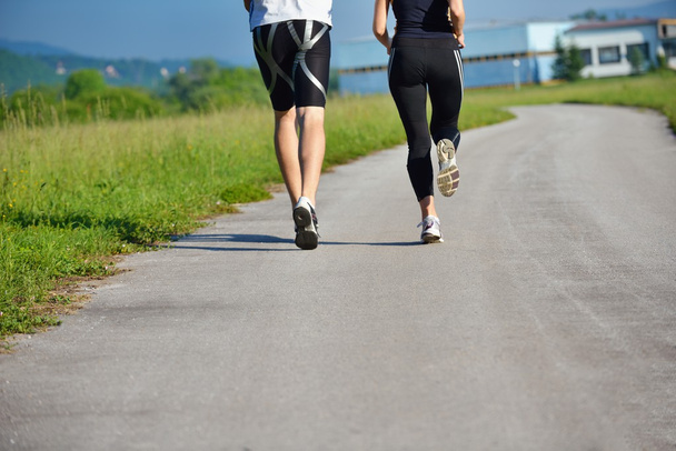 Young couple jogging at morning - Foto, afbeelding