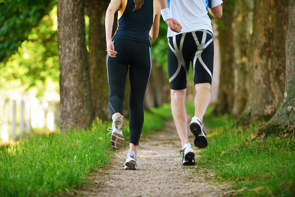 Young couple jogging at morning - Foto, imagen