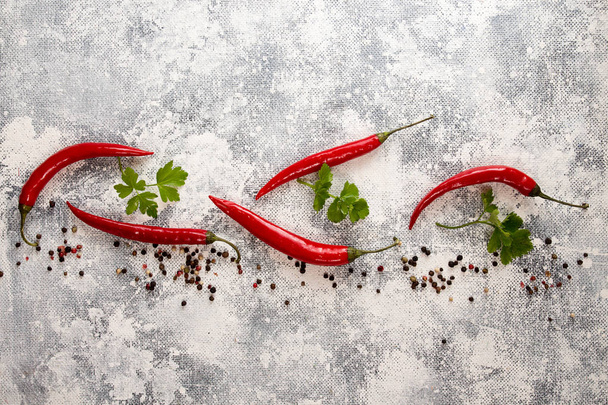 Red chili pepper on white-black background. Composition of group - Foto, immagini