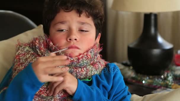 Portrait of a sick child feeling cold in winte - Video, Çekim