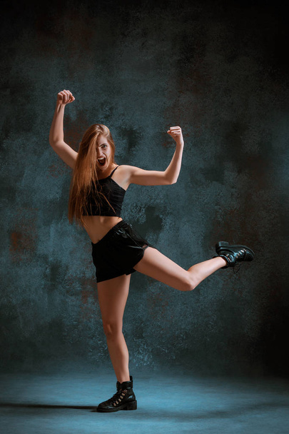 Attractive girl dancing twerk in the studio - Фото, зображення