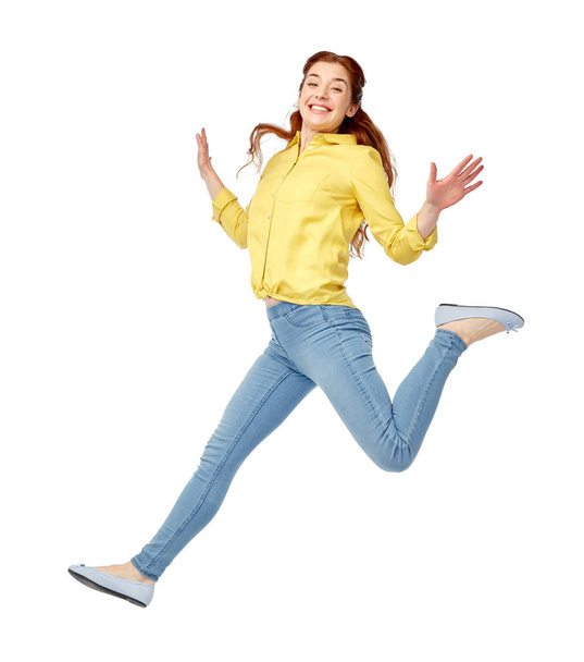 smiling young woman jumping in air - Foto, afbeelding