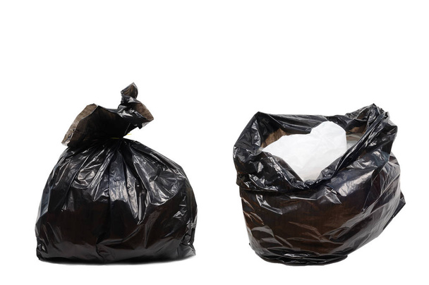 Dubbele zwarte plastic vuilniszakken op witte achtergrond, knippen  - Foto, afbeelding