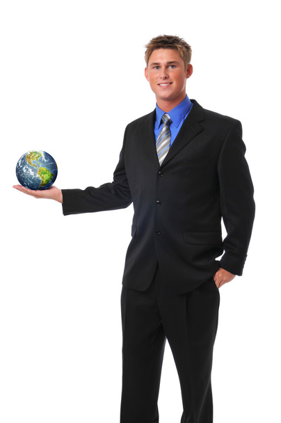Young businessman holding the earth - Valokuva, kuva