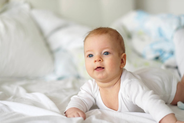 Baby with blue eyes - Fotó, kép