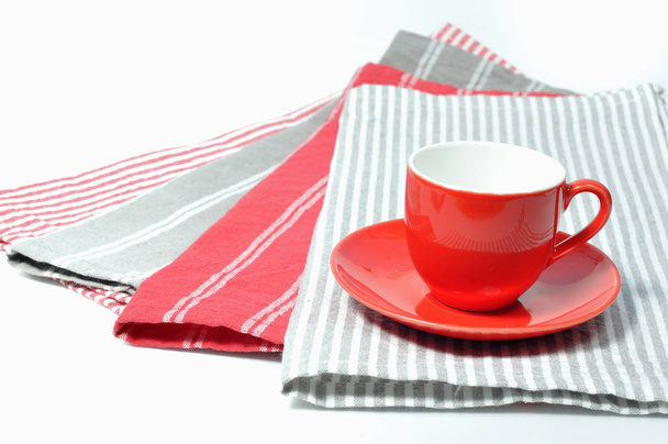 Cup of coffee set lay on various napkins - Φωτογραφία, εικόνα
