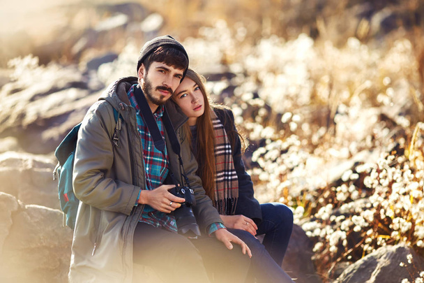 young couple, hipster outfit, fashion style, in love, woman and man, sea on background, warm winter day, sunny. tenderness - Φωτογραφία, εικόνα