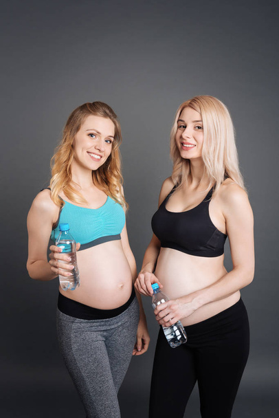 Two happy pregnant women after training - Photo, image