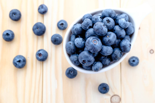 fresh blueberry on wood background - Valokuva, kuva