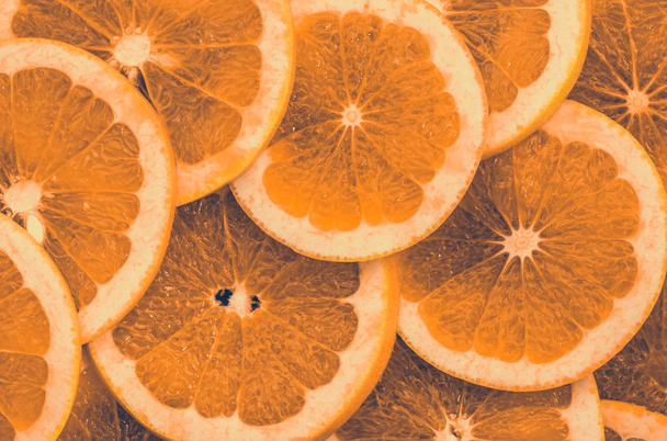 Texture of orange slices, close view, overhead, red citrus backg - Foto, Bild