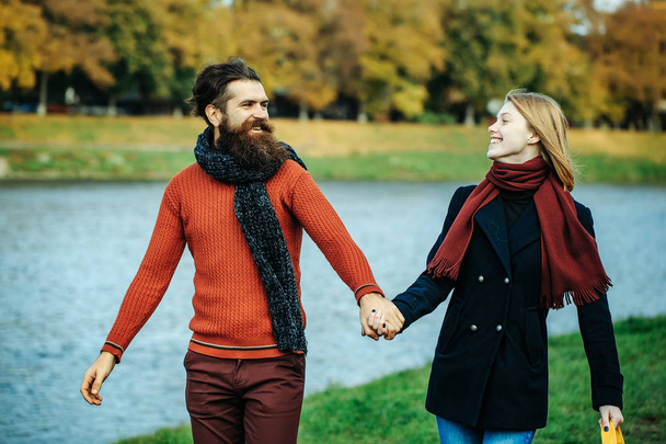 Young couple in autumn park - Fotó, kép