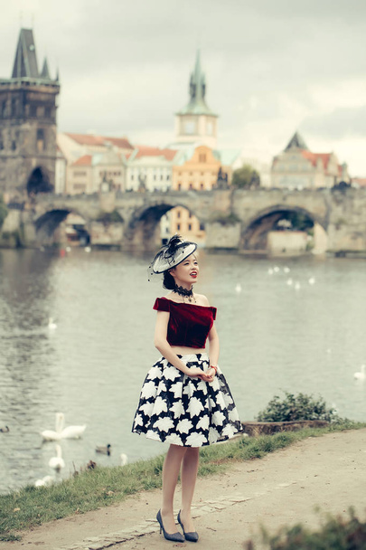 Pretty girl walks along river - Fotoğraf, Görsel