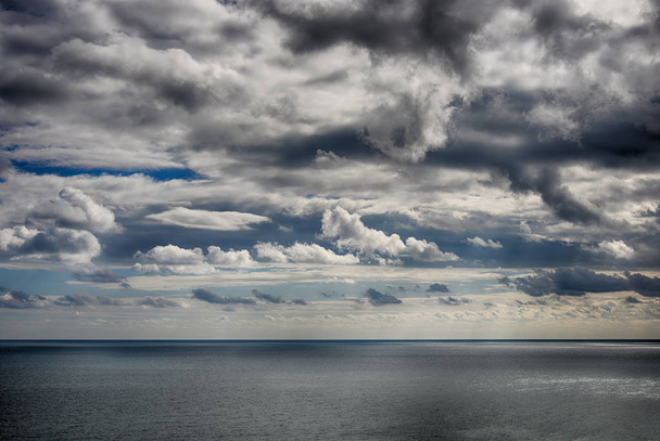 Beautiful sky over the sea after the storm. High Dynamic Range photo - 写真・画像