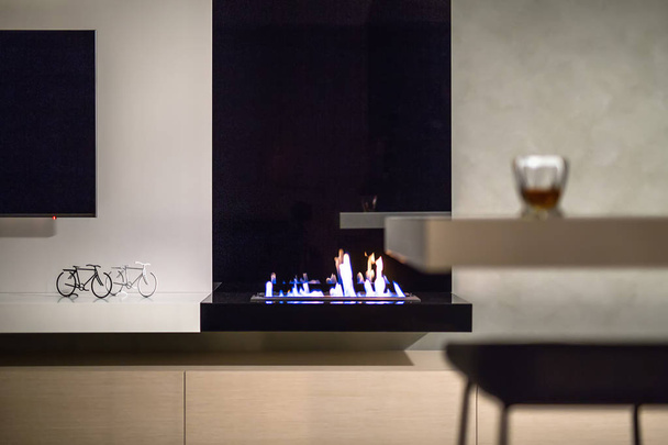 Burning fireplace in modern interior - Zdjęcie, obraz