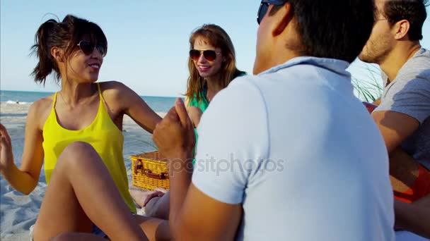 students chilling on  beach - Footage, Video