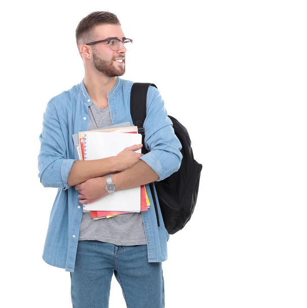 Молодой человек, стоящий с сумкой на белом фоне
 - Фото, изображение
