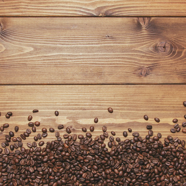Wooden background with coffee beans - Foto, Bild