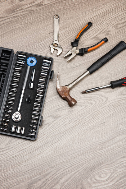 The repair tools is placed on the wooden table. - Photo, Image