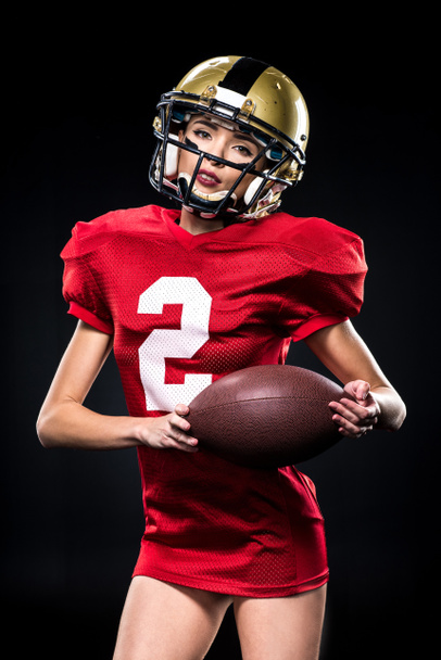 Female football player in helmet - Foto, afbeelding