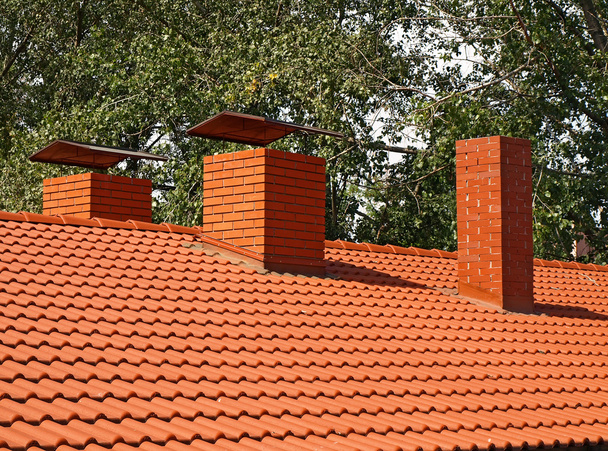 The roof is covered with orange tiles - Photo, Image
