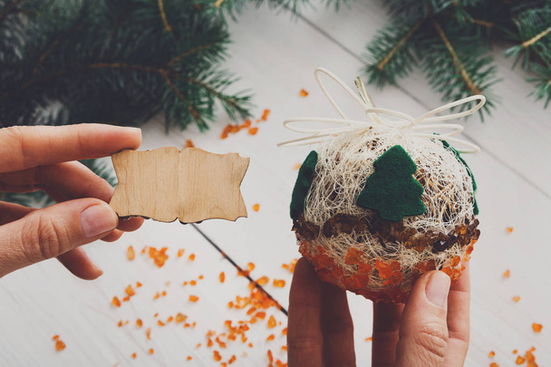 Creative diy hobby. Handmade craft christmas decoration ball with tree - Photo, Image